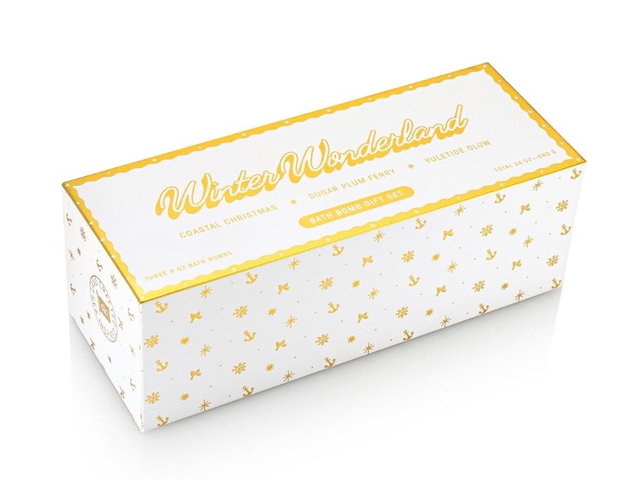 White box with gold text and patterns on a white background