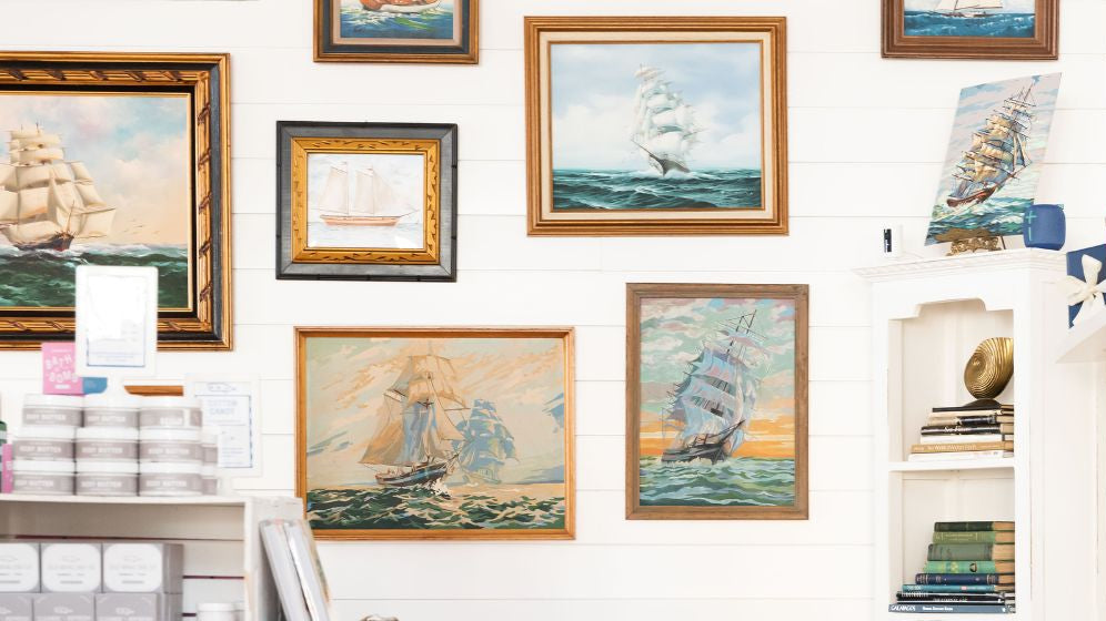 Paintings of ships on King Street shop's wall