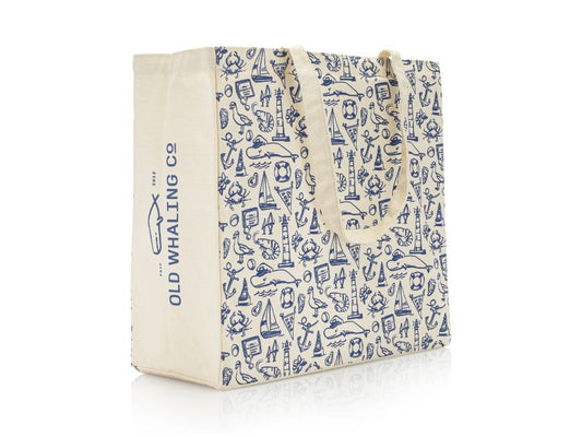 Old Whaling Company canvas tote with navy print featuring whale, sailboat, lighthouse and other nautical icons on white background showing side with Old Whaling Company logo