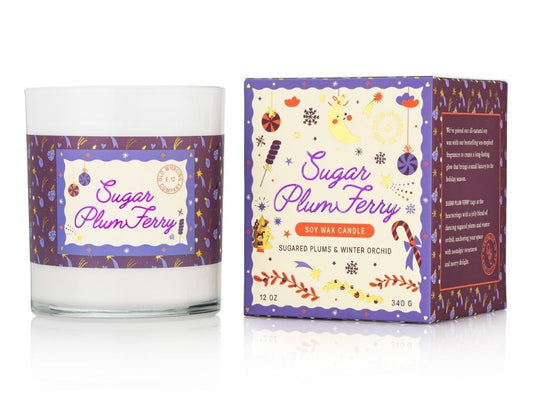 Candle with 'Sugar Plum Ferry' label and matching packaging on a white background