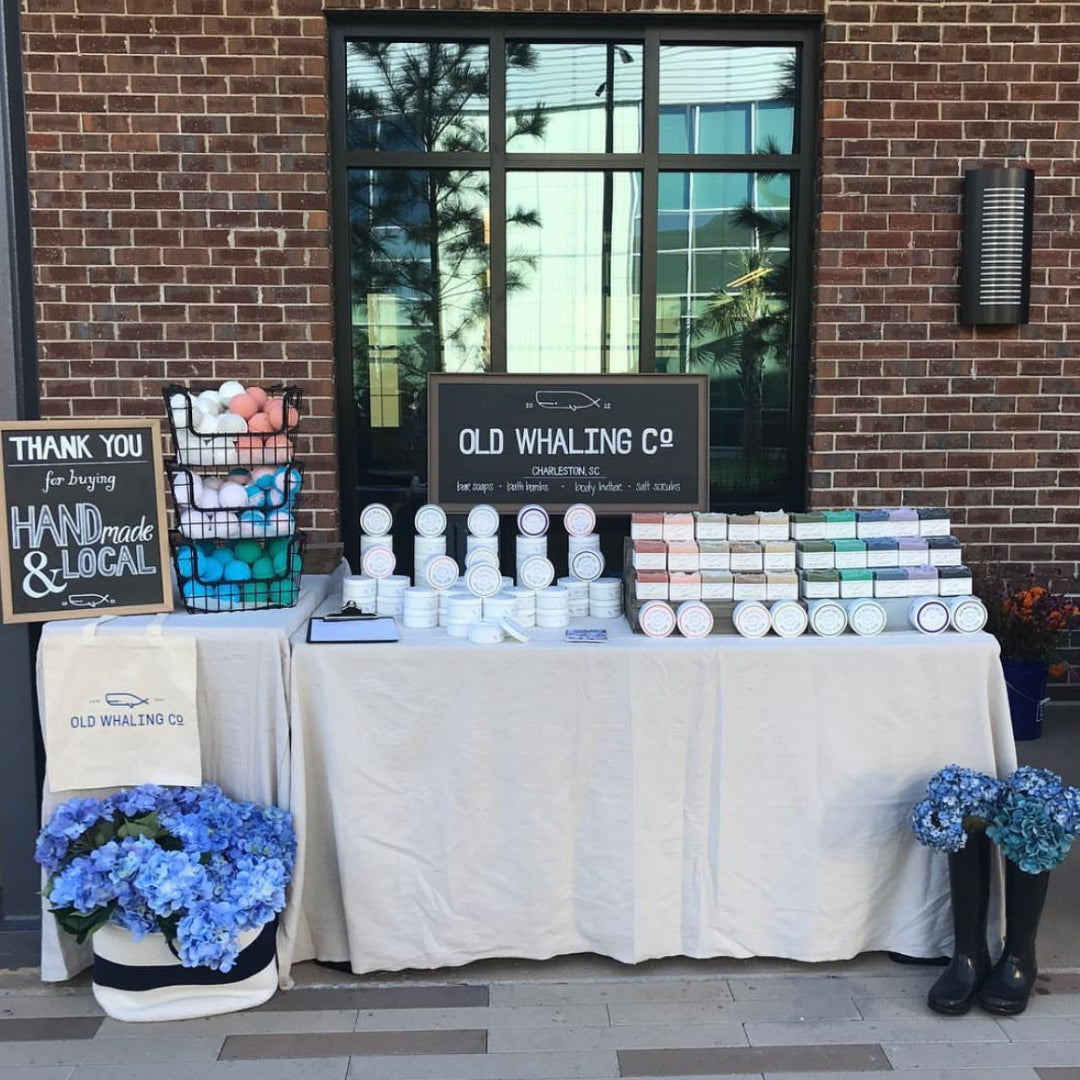 Photo of Old Whaling Co. set up as a small booth at a farmers market years ago