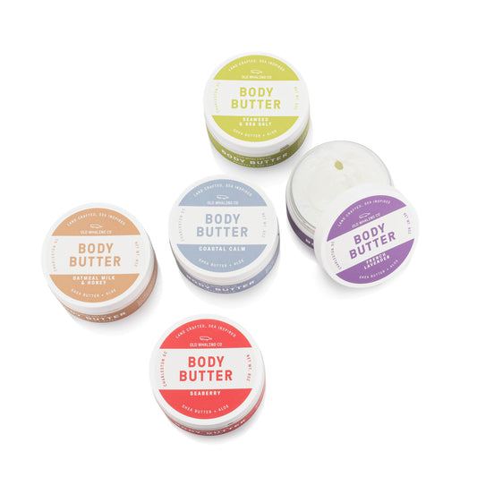 5 body butters on a white background