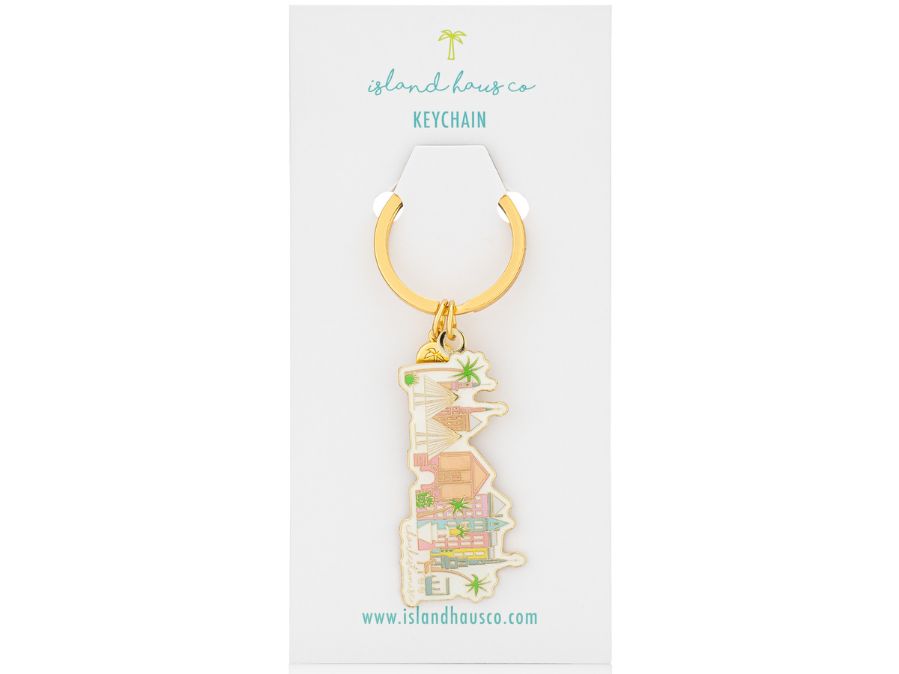 Charleston Keychain by Island Haus Co on white background, keychain has colorful houses, sailboats and palm trees design