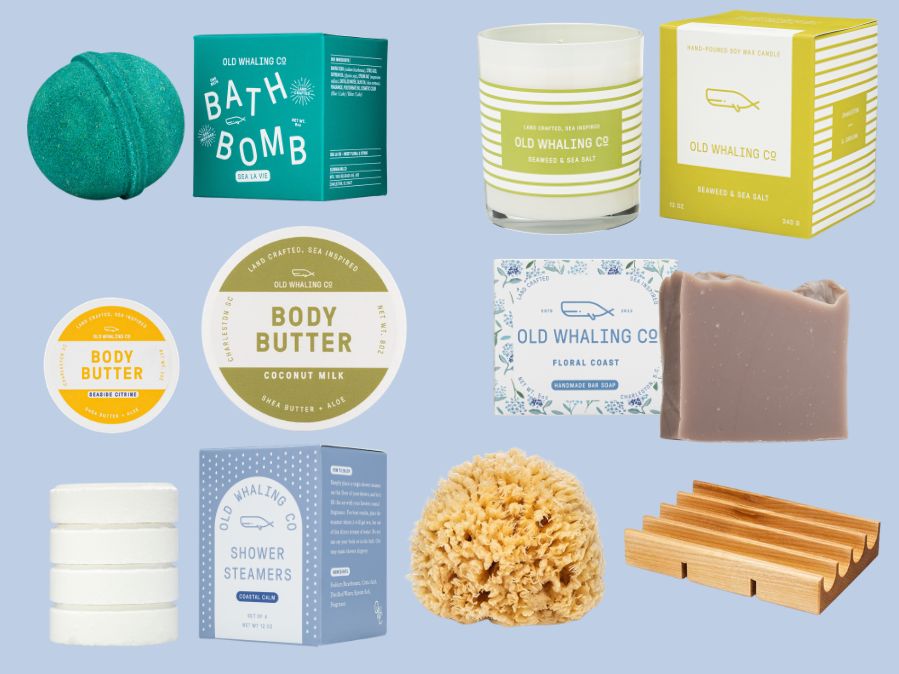 Deluxe collection of coastal Old Whaling Co. skincare and bath products on a light blue background