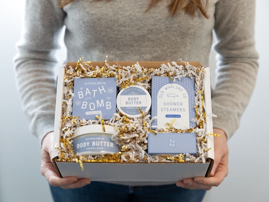 Kelly holding Old Whaling Company Coastal Calm® gift box 