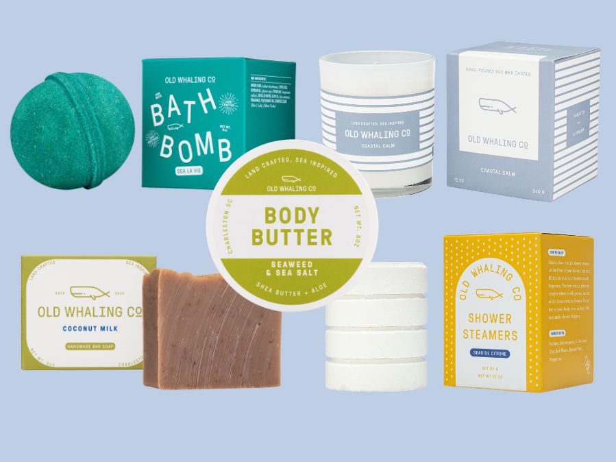 Collection of Old Whaling Co. coastal skincare and bath products on a light blue background