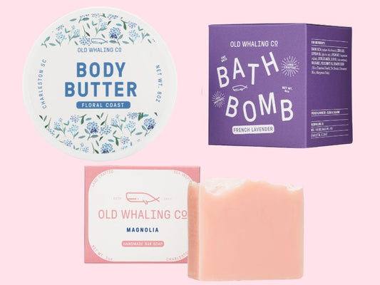 Old Whaling Co floral skincare products including body butter, bath bomb, and soap on a pink background
