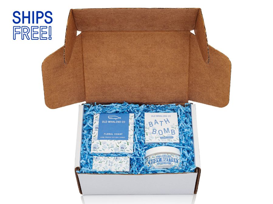 Floral Coast gift box with Floral Coast items in a white gift box with blue crinkle on a white background with ships free note