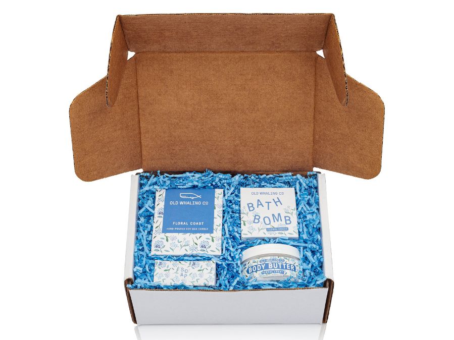 Floral Coast gift box with Floral Coast items in a white gift box with blue crinkle on a white background 