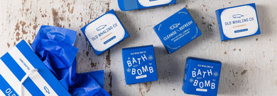 Oceanswept® bar soaps and bath bombs spilling out of Old Whaling Co Retail Bag