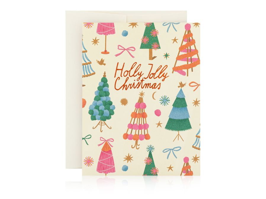 Holly Jolly Trees Greeting Cards by Red Cap on white background. Card has cream background with multi colored Christmas trees and "Holly Jolly Christmas" written across the front. 