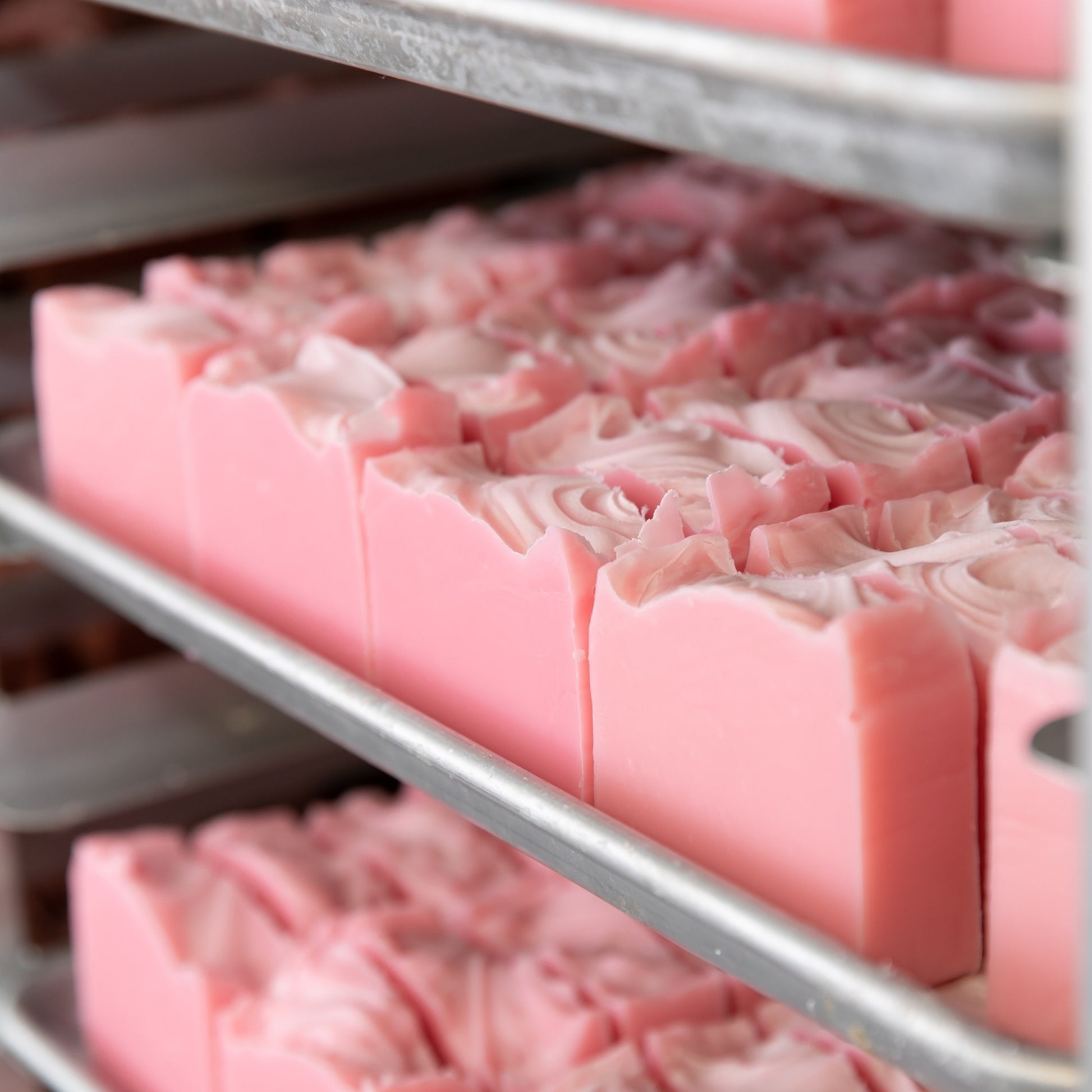Unboxed Magnolia Bar Soaps curing on soap trays