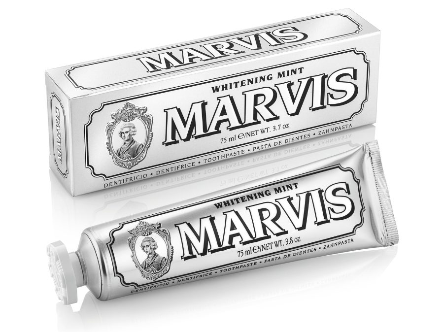 Marvis whitening mint toothpaste tube and packaging on a white background