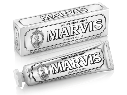 Marvis whitening mint toothpaste tube and packaging on a white background
