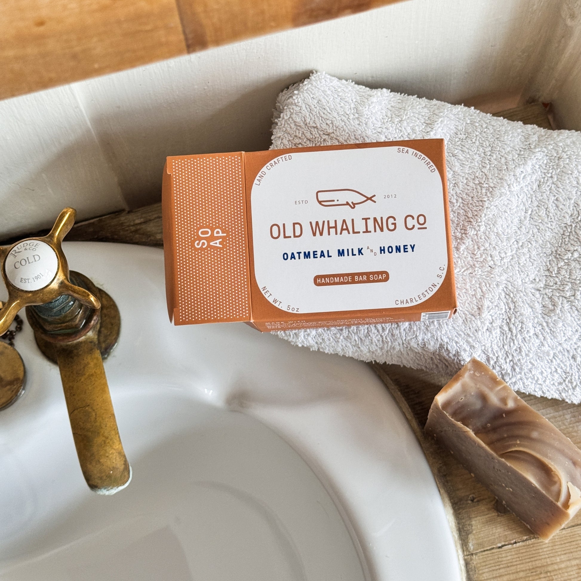 Oatmeal Milk & Honey Bar Soap Box sits open beside sink