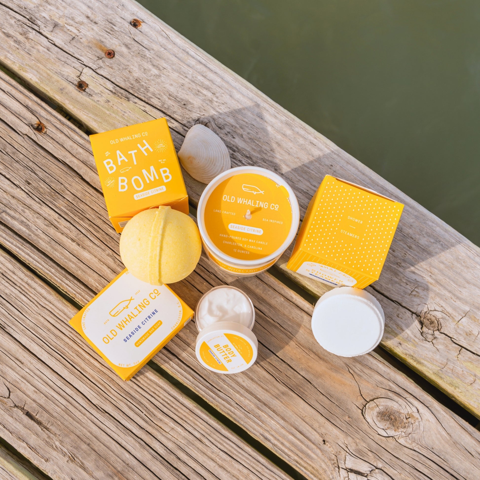 Top view of Seaside Citrine product line on wood dock beside water