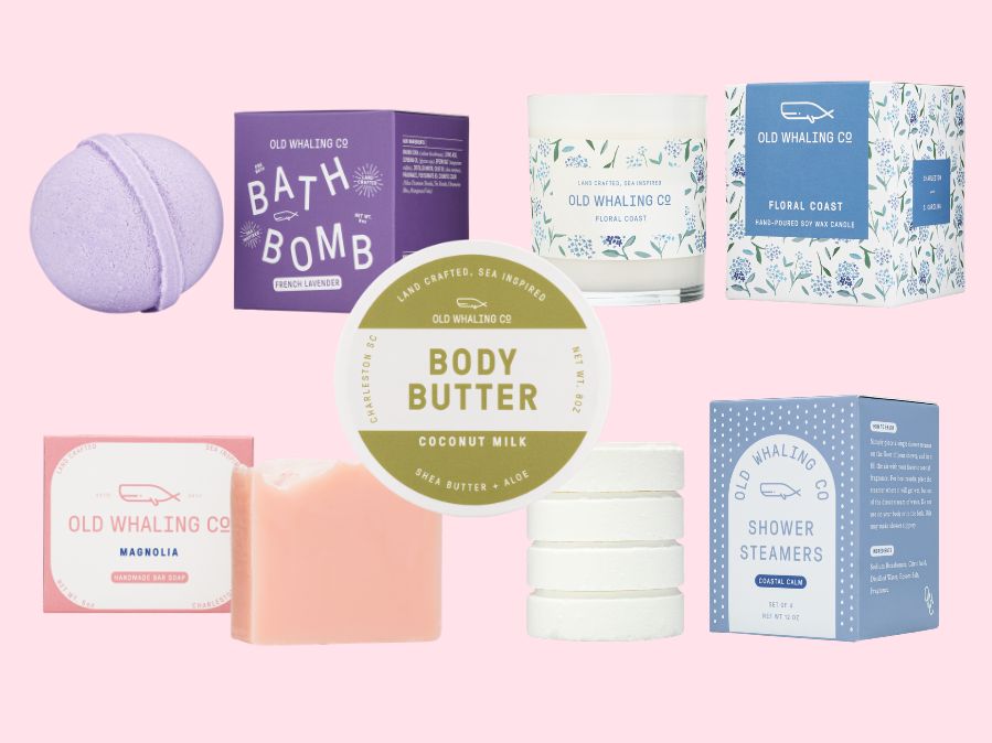 Collection of Old Whaling Co. floral and coastal bath and body products on a pink background