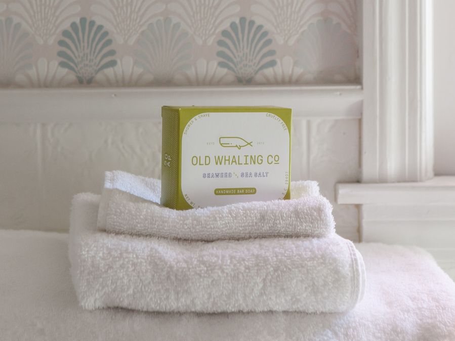 Old Whaling Company Seaweed & Sea Salt Soap on hand towel in bathroom