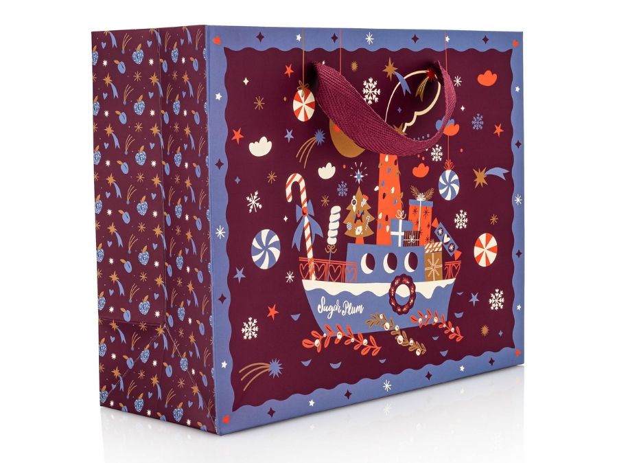 Decorative gift bag with festive design on a white background