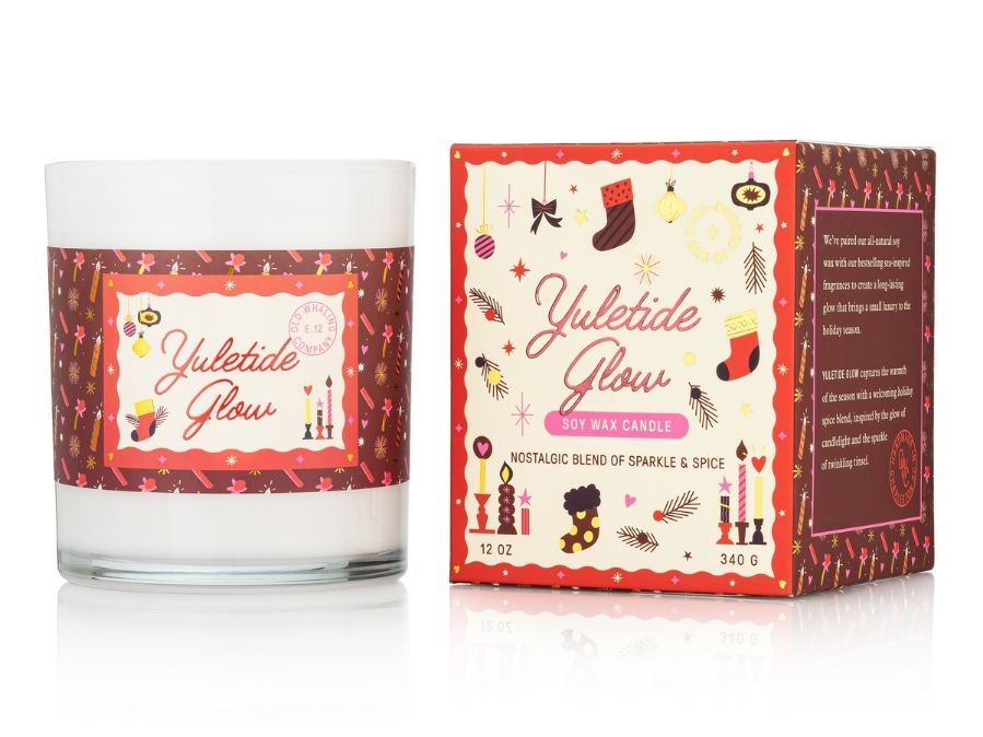 Yuletide Glow candle and packaging on a white background