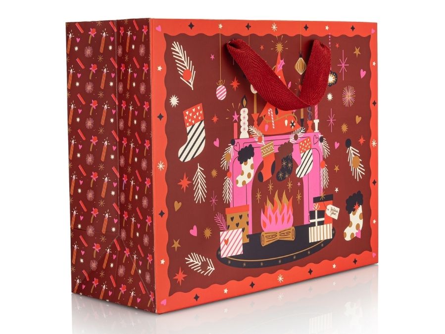 Decorative gift bag with festive design on a white background